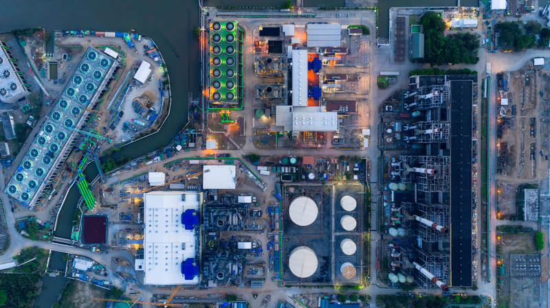 Aerial top view Power plant or Power house at the side of river for electric energy supply background.