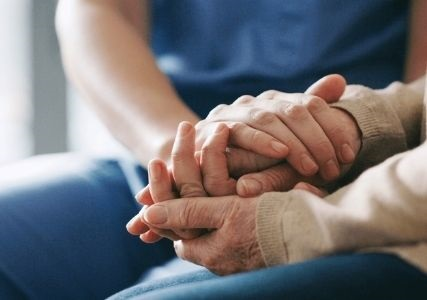 Two people holding hands.