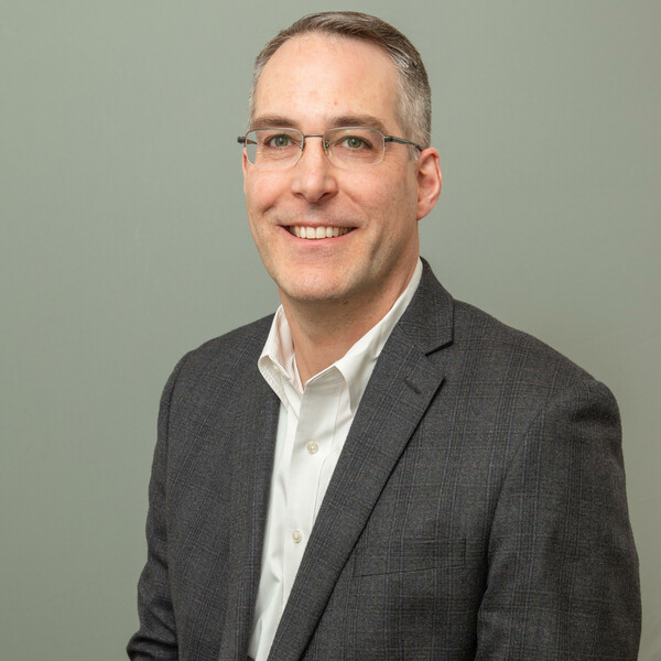 Standard BMC headshot.
