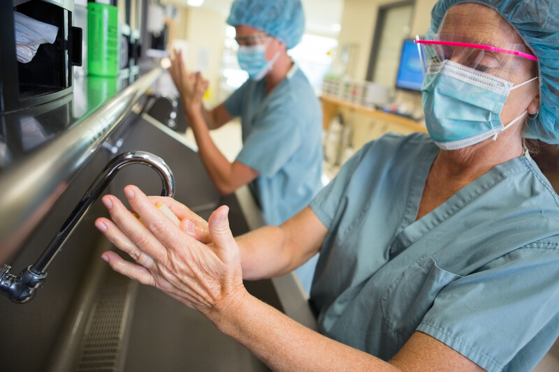 bigst-Mature-doctor-scrubbing-hands--54631181 _Healthcare-related,